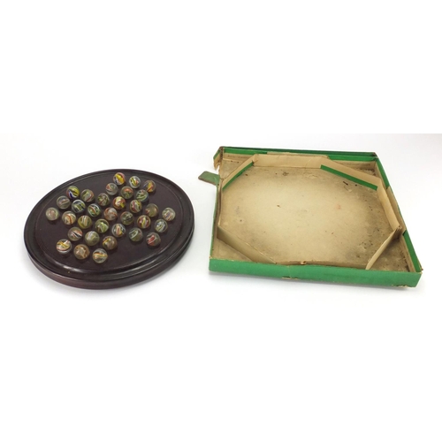 649 - Victorian solitaire board with marbles and box, the board 30cm in diameter, each marble approximatel... 