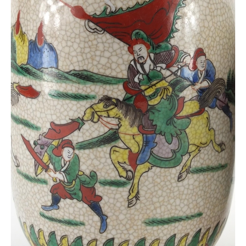 2197 - Chinese porcelain jar and vase, each hand painted in the famille verte palette with warriors on hors... 