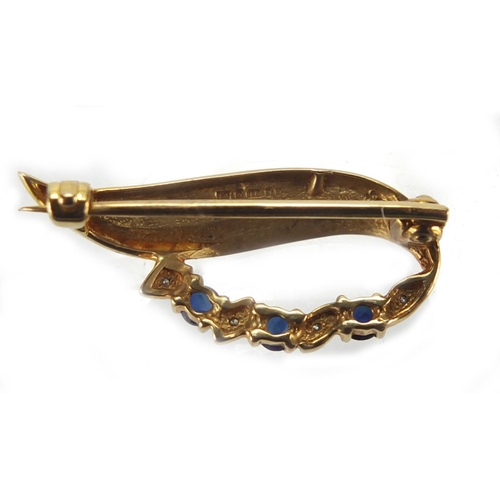 2645 - 9ct gold diamond and sapphire brooch, 3cm in length, approximate weight 2.2g