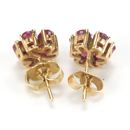 2670 - Pair of 9ct gold ruby and diamond flower head earrings, 8mm in diameter, approximate weight 2.1g