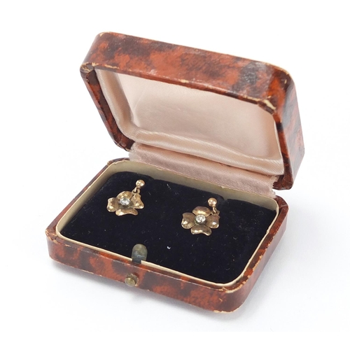 2637 - Pair of 9ct gold diamond flower head earrings, 1cm in diameter, approximate weight 1.3g