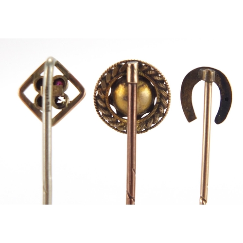 2721 - Three gold stick pins, one set with a solitaire diamond, approximate weight 2.5g