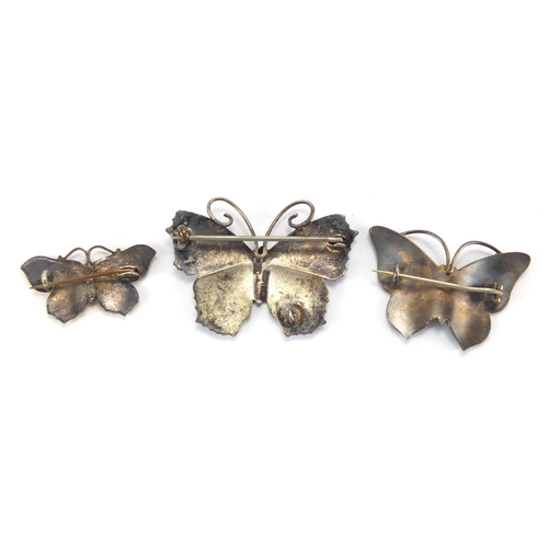 2682 - Three silver and enamel butterfly brooches, the largest 4.5cm in length, approximate weight 18.2g