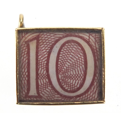 2760 - 9ct gold emergency ten shilling note charm, 1.5cm in length, approximate weight 2.5g