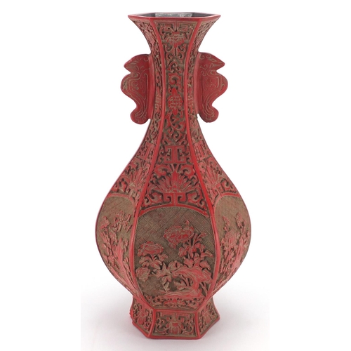 2166 - Chinese Cinnabar lacquer hexagonal vase, with twin handles carved with flowers, four figure characte... 