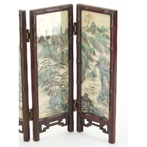 2236 - Oriental four fold screen, each panel hand painted with birds of Paradise and a river landscape, 26c... 