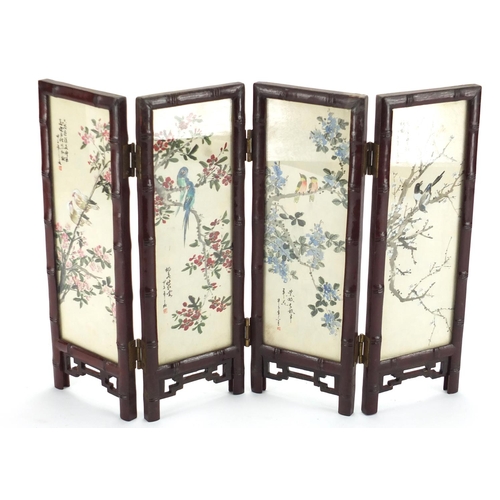 2236 - Oriental four fold screen, each panel hand painted with birds of Paradise and a river landscape, 26c... 