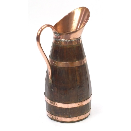 72 - Large oak and copper pitcher, 62cm high