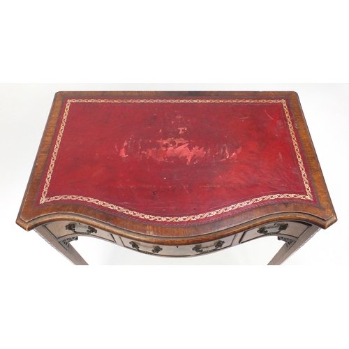 2018 - Victorian mahogany serpentine fronted writing desk with tooled leather top, three drawers on blind f... 