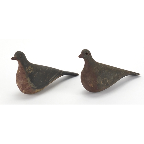 94 - Two antique hand painted carved wood pigeons decoys, one with beaded glass eyes, each 29cm in length