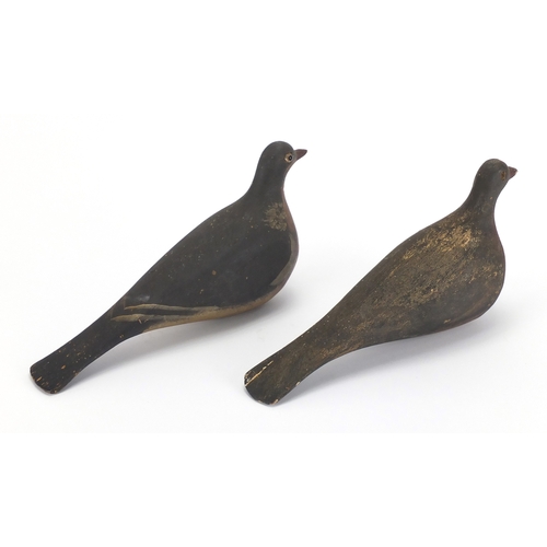 94 - Two antique hand painted carved wood pigeons decoys, one with beaded glass eyes, each 29cm in length