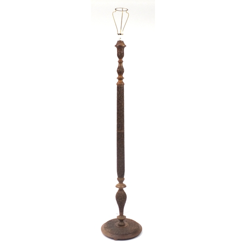 2077 - Indian Hardwood standard lamp, profusely carved with scrolling foliage, 160cm high