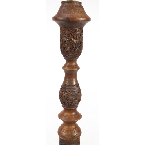 2077 - Indian Hardwood standard lamp, profusely carved with scrolling foliage, 160cm high