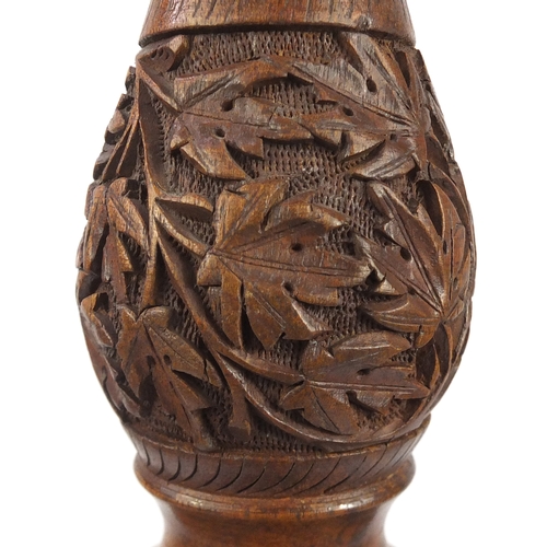 2077 - Indian Hardwood standard lamp, profusely carved with scrolling foliage, 160cm high