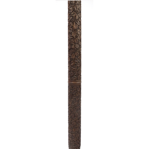 2077 - Indian Hardwood standard lamp, profusely carved with scrolling foliage, 160cm high