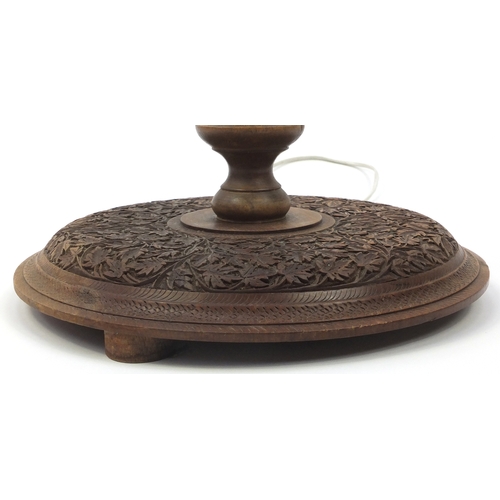 2077 - Indian Hardwood standard lamp, profusely carved with scrolling foliage, 160cm high