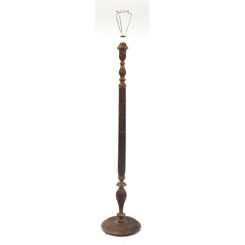 2077 - Indian Hardwood standard lamp, profusely carved with scrolling foliage, 160cm high