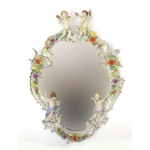 2053 - Continental floral encrusted porcelain cartouche wall mirror, hand painted and decorated with putti,... 