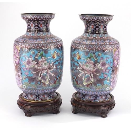 2171 - Large pair of Chinese cloisonné vases on hardwood stands, each enamelled with birds of Paradise and ... 