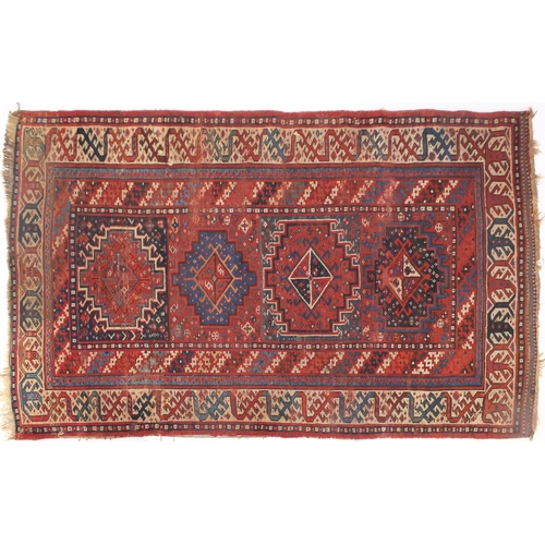 2064 - Rectangular Middle Eastern rug having an all over stylised geometric design within corresponding boa... 