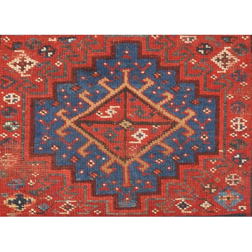 2064 - Rectangular Middle Eastern rug having an all over stylised geometric design within corresponding boa... 