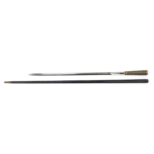 105 - Black painted metal swordstick with brass handle embossed with a Chinese dragon, 89.5cm in length