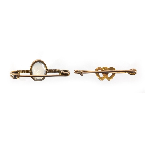 2618 - Two unmarked gold bar brooches, set with seed pearls and a moonstone, the largest 3.2cm in length, a... 