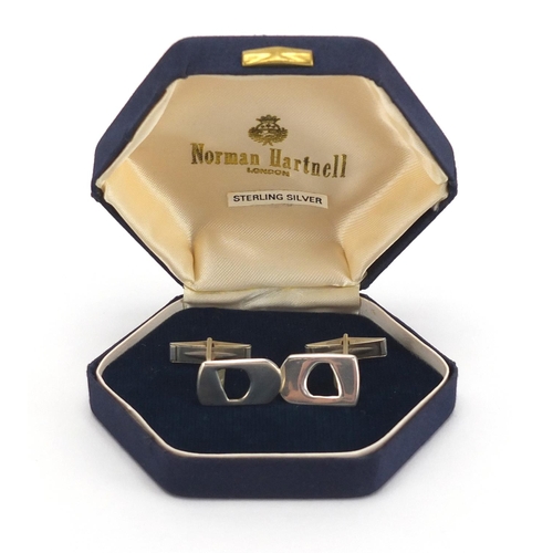 2769 - Pair of designer silver cuff links, housed in a Norman Hartnell box