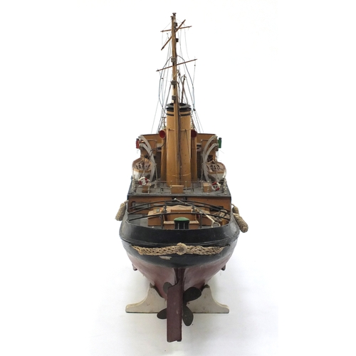 109 - 1940's scratch built model boat, Stormkin Devonport, on wooden stand, 56cm high x 102cm in length