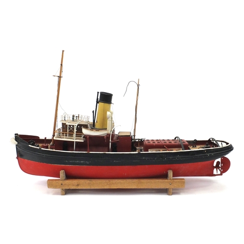 110 - Scratch built model boat on wooden stand, 48cm high x 79cm in length