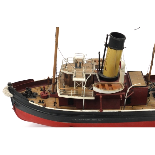 110 - Scratch built model boat on wooden stand, 48cm high x 79cm in length