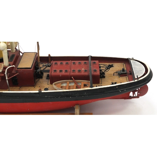 110 - Scratch built model boat on wooden stand, 48cm high x 79cm in length