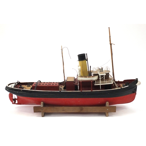 110 - Scratch built model boat on wooden stand, 48cm high x 79cm in length