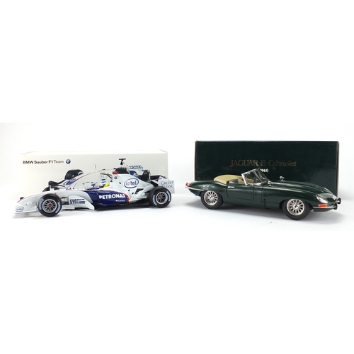 676 - Two die cast vehicles with boxes, scale 1:18 including a Nick Heidfield BMW Sauber