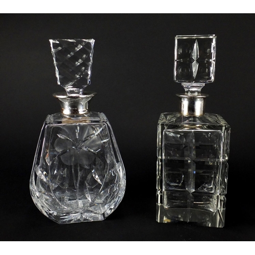 2190 - Three cut glass decanters, with silver collars including two with a flower design, the largest 25.5c... 