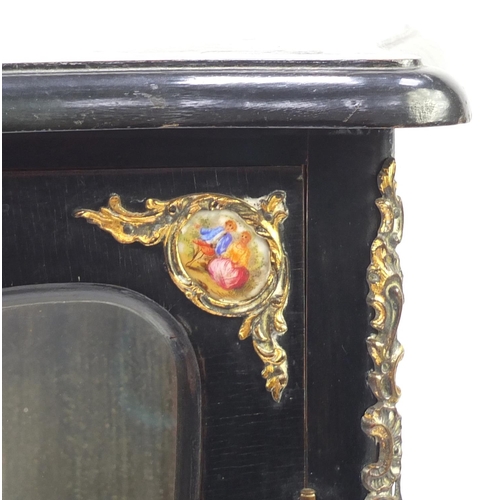 2039 - French ebonised pier cabinet, with gilt metal mounts and porcelain panels hand painted with figures,... 