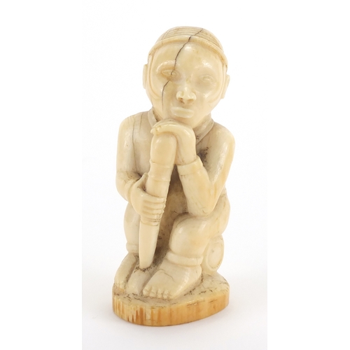 609a - Good African ivory carving of a tribesman holding a club, 10cm high