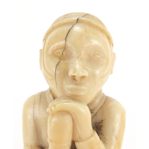 609a - Good African ivory carving of a tribesman holding a club, 10cm high