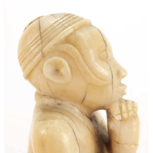 609a - Good African ivory carving of a tribesman holding a club, 10cm high