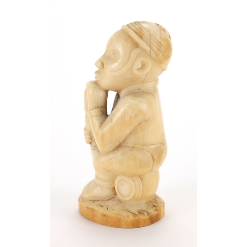 609a - Good African ivory carving of a tribesman holding a club, 10cm high