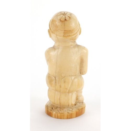 609a - Good African ivory carving of a tribesman holding a club, 10cm high