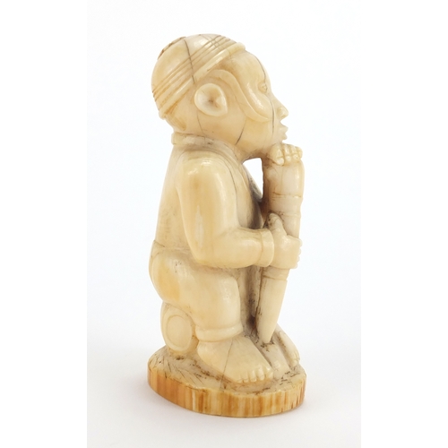 609a - Good African ivory carving of a tribesman holding a club, 10cm high