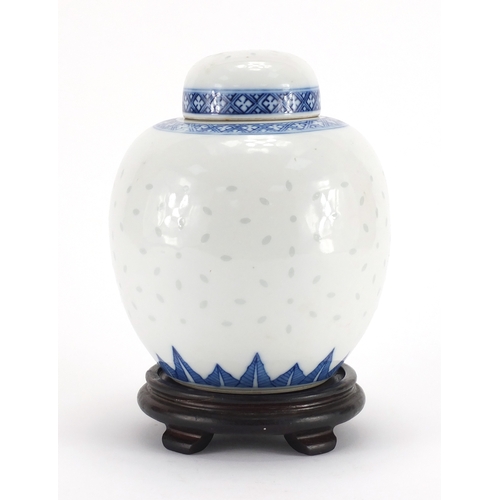 2337 - Chinese blue and white porcelain ginger jar and cover on hardwood stand, blue ring marks to the base... 