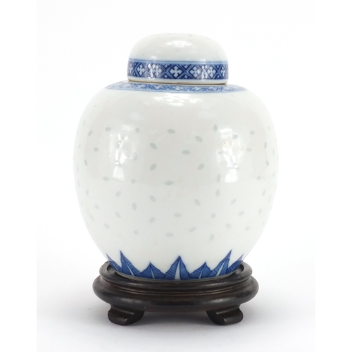 2337 - Chinese blue and white porcelain ginger jar and cover on hardwood stand, blue ring marks to the base... 