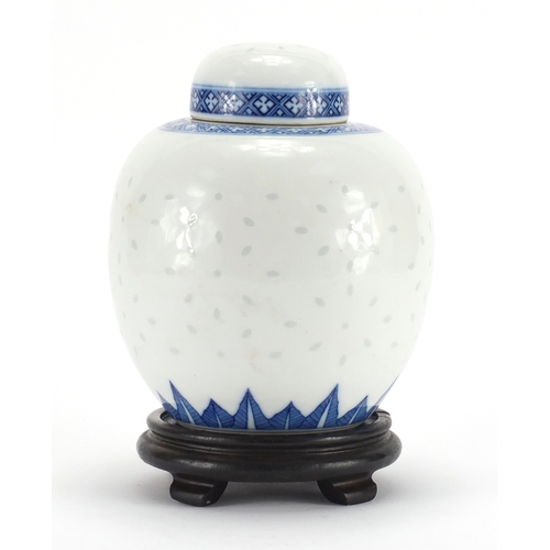 2337 - Chinese blue and white porcelain ginger jar and cover on hardwood stand, blue ring marks to the base... 