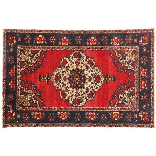 30 - Rectangular Persian rug, with all over floral design onto a predominantly blue and red ground, 200cm... 