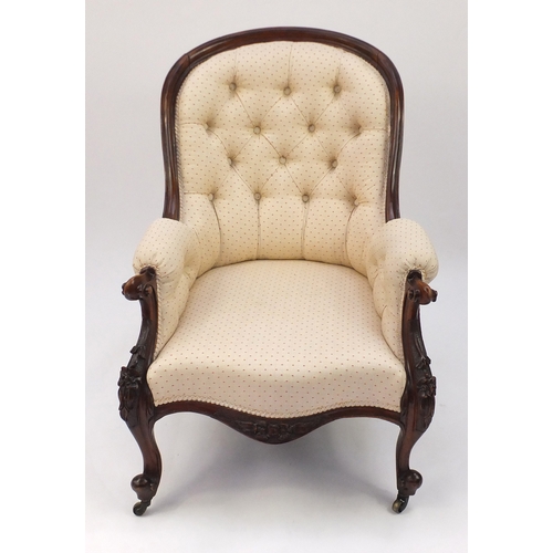 2016 - Victorian carved walnut gentleman's armchair, with beige flecked button back upholstery, 91cm high