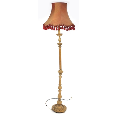 45 - Carved lightwood standard lamp