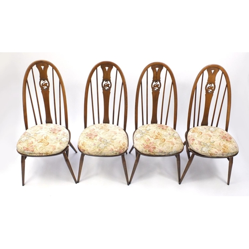 15A - Ercol elm drop leaf dinning table and four stick back chairs, with swan carved backs, the table 72cm... 