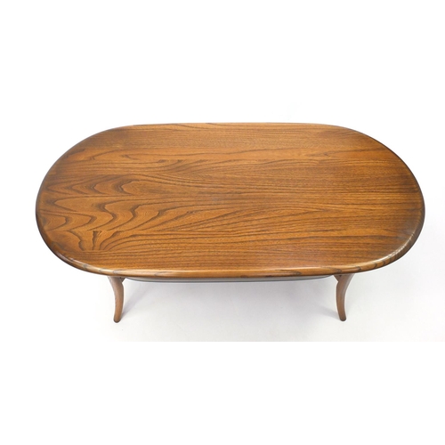 20A - Ercol elm oval coffee table with glass under tier, 48cm H x 113cm W x 58cm D
